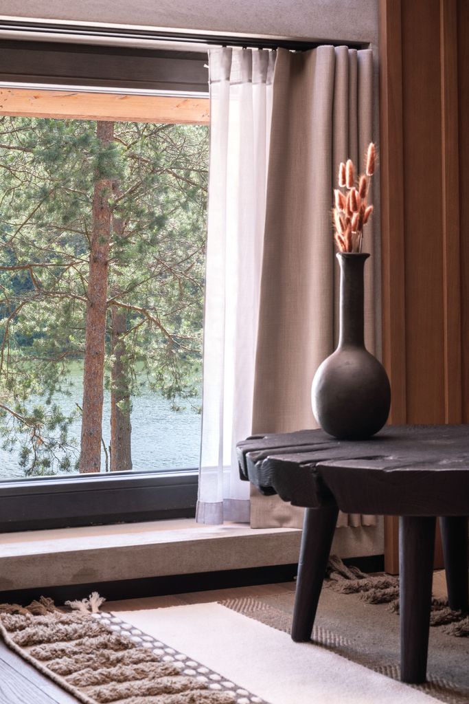 Close-up detail of natural wood and stone showcasing the aesthetic of the luxury resort. 