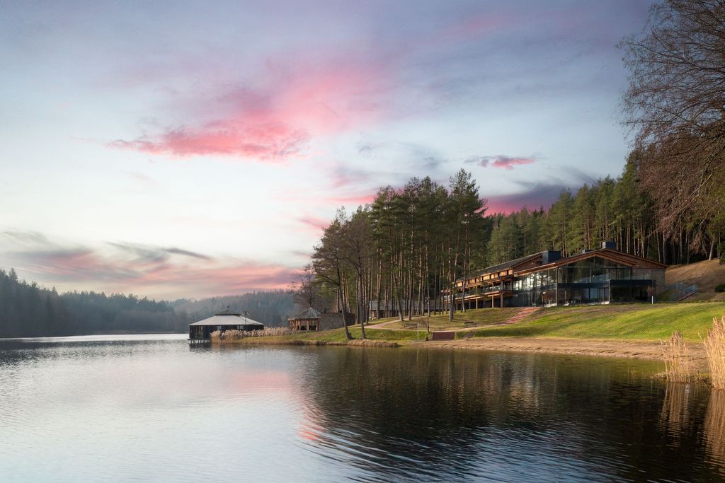 Luxury exterior of Esperanza Lake Resort set in pristine nature by a private lake.