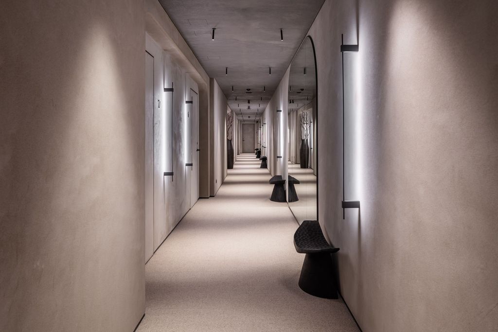Hallway of a luxury Esperanza spa and resort, suggesting well-designed rooms and suites.