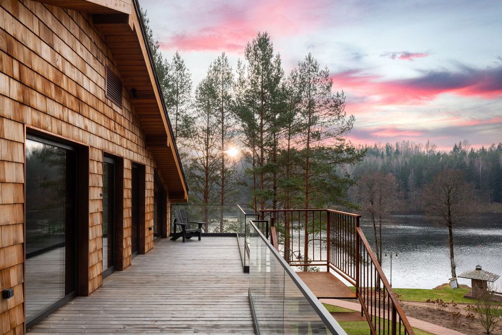 Luxury resort loft room with terrace and forest panorama at Esperanza Lake Resort.