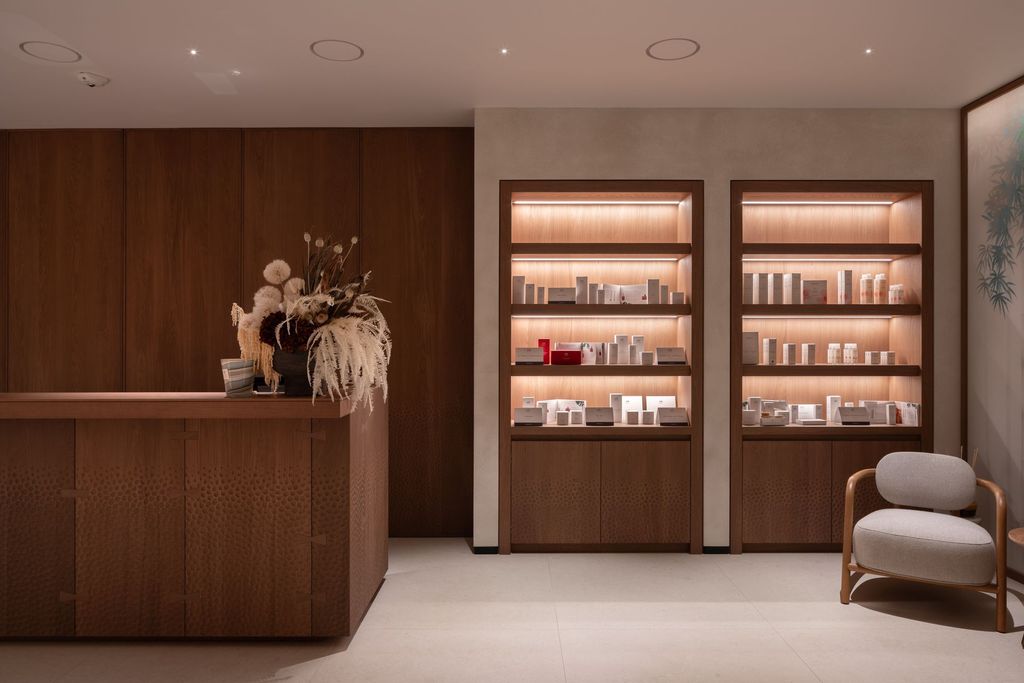 Welcoming spa reception area with natural tones and calming contemporary design.