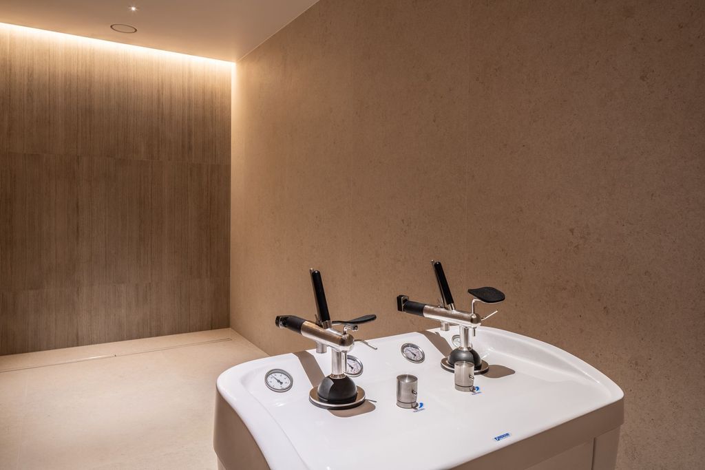 Calming treatment space with warm lighting and elegant design for wellness rituals.
